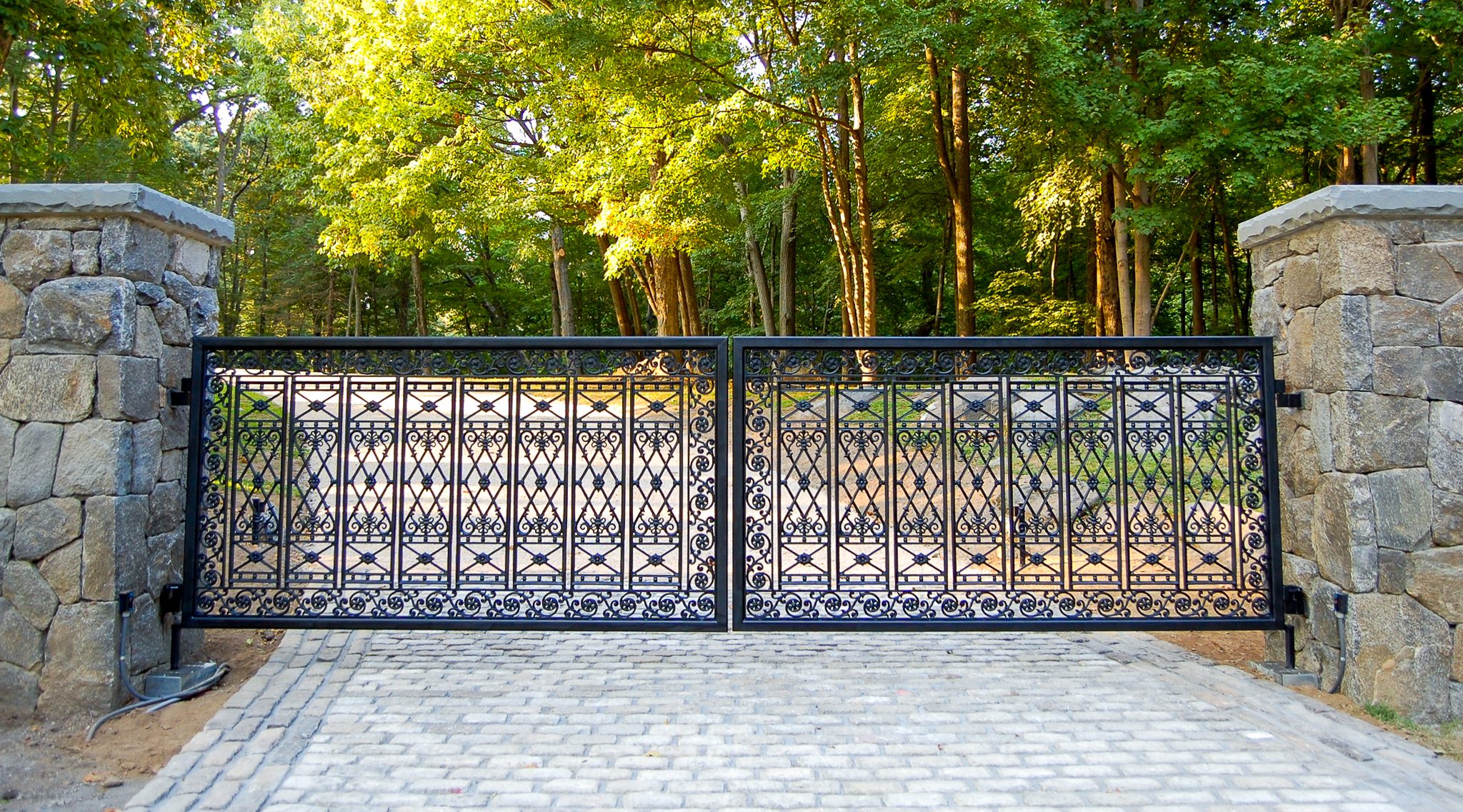 The ornamentation on this wrought iron gate is small and exquisitely detailed.